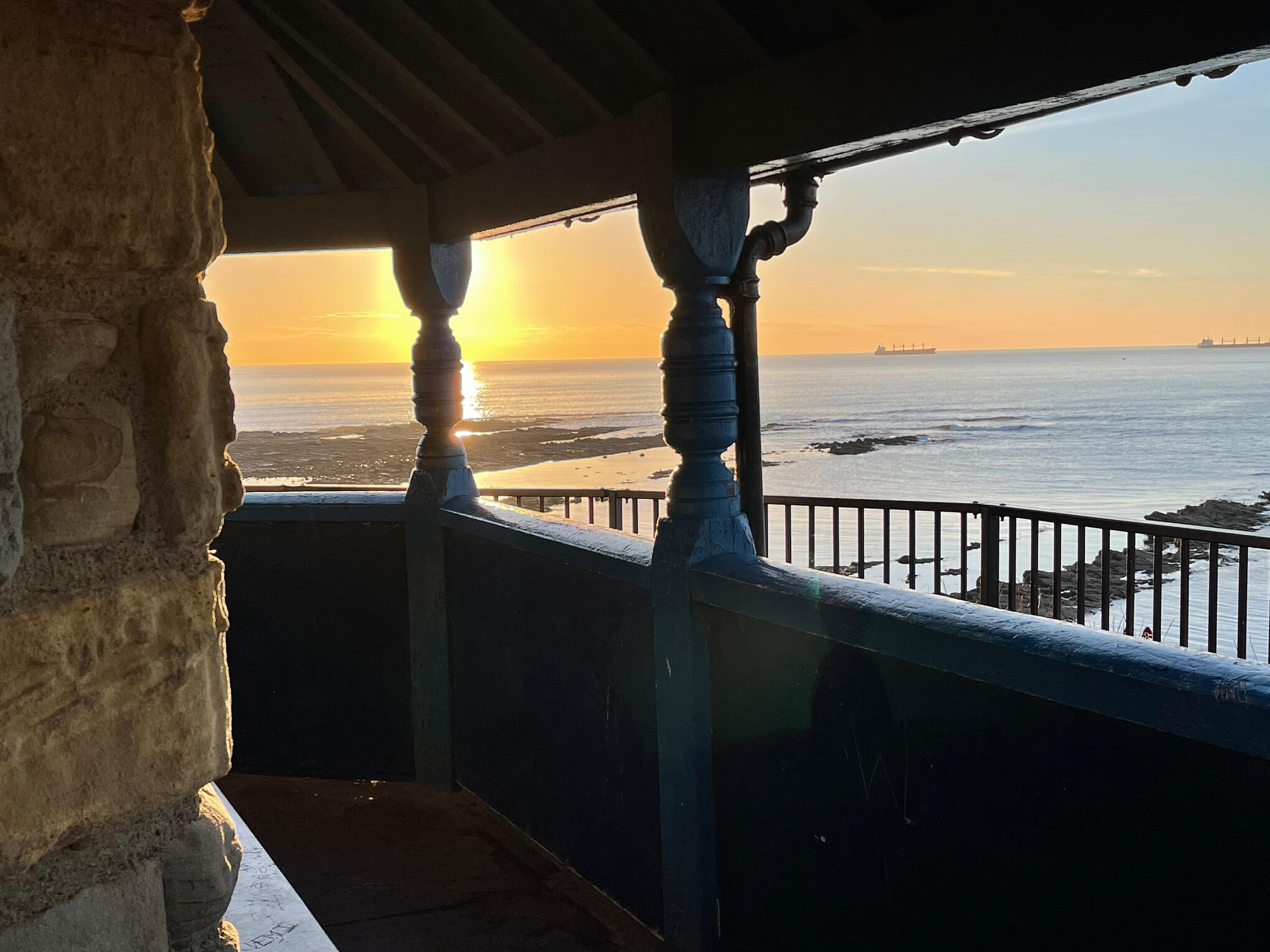 A view of the ocean from the Watch House's veranda just as the sun is setting.
